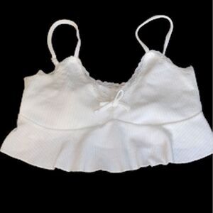 White crop camisole top. Ribbed material bow on the front. Pulls overhead.